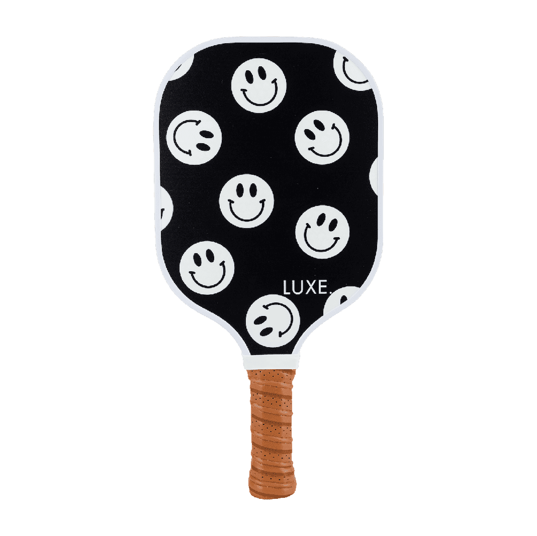 Smiley face pickleball paddle with leather grip luxe clipart logo